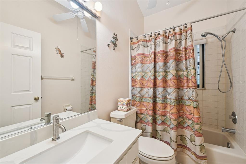 13221 North Branch Road Sarasota, FL 34240 - Photo 32 of 64 a bathroom with a sink toilet and shower