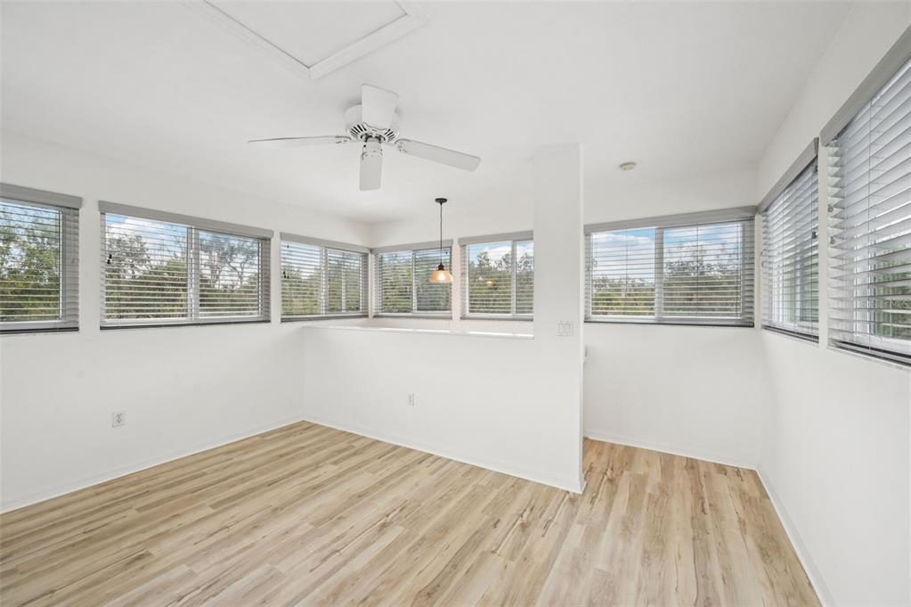 13221 North Branch Road Sarasota, FL 34240 - Photo 36 of 64 a view of empty room with wooden floor and fan
