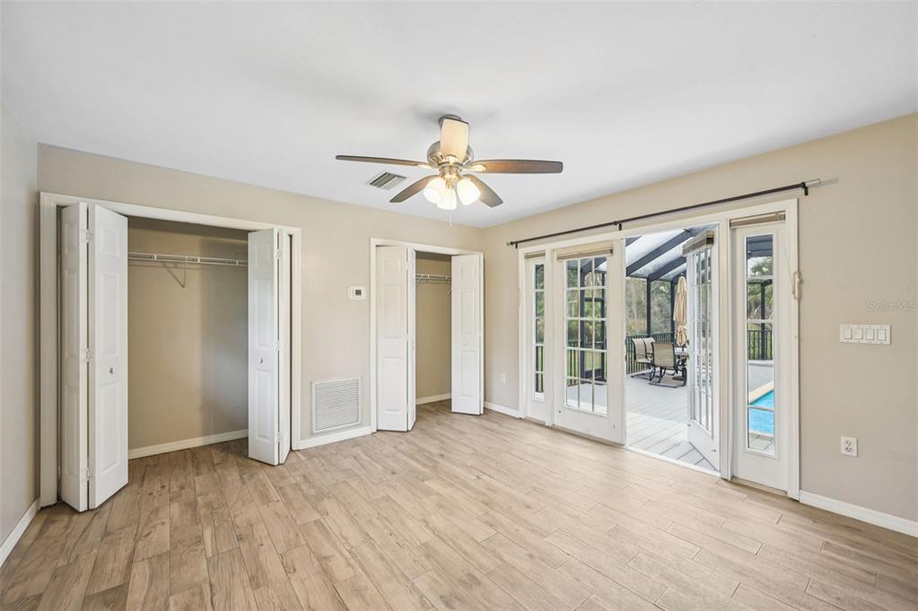 13221 North Branch Road Sarasota, FL 34240 - Photo 38 of 64 wooden floor in an empty room with a window