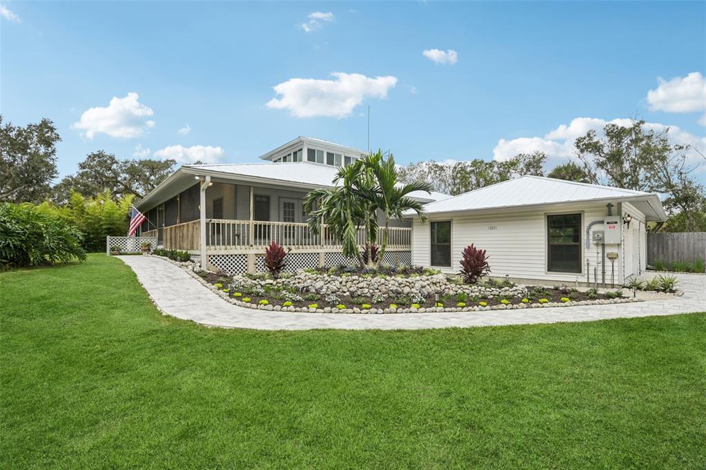 13221 North Branch Road Sarasota, FL 34240 - Photo 5 of 64 a view of a house with a yard porch and sitting area