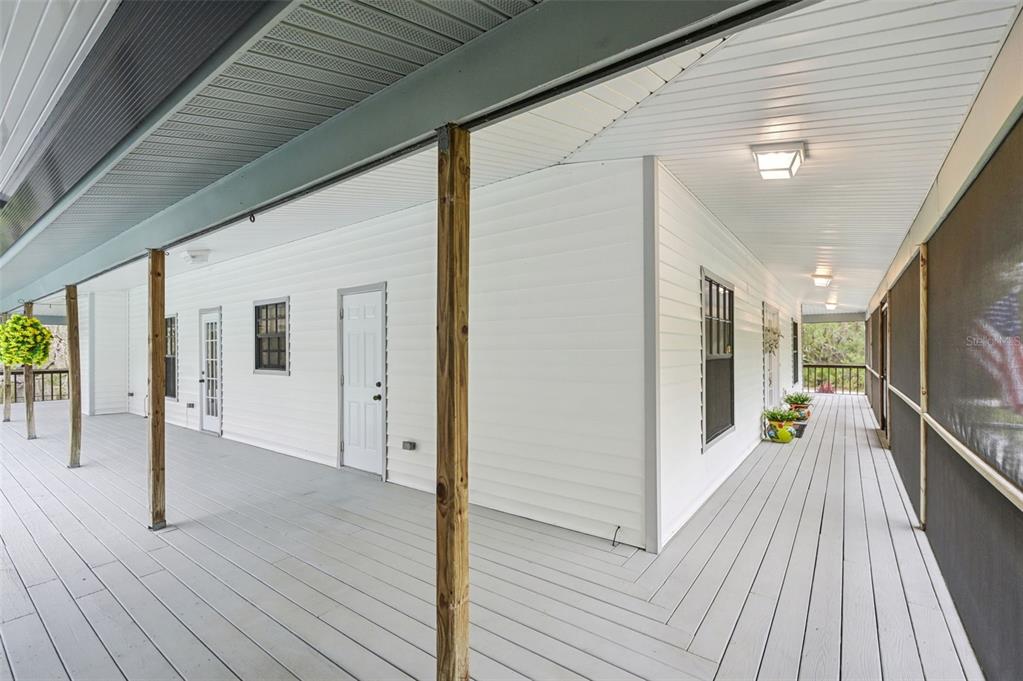 13221 North Branch Road Sarasota, FL 34240 - Photo 56 of 64 a view of a hallway with wooden floor and glass door