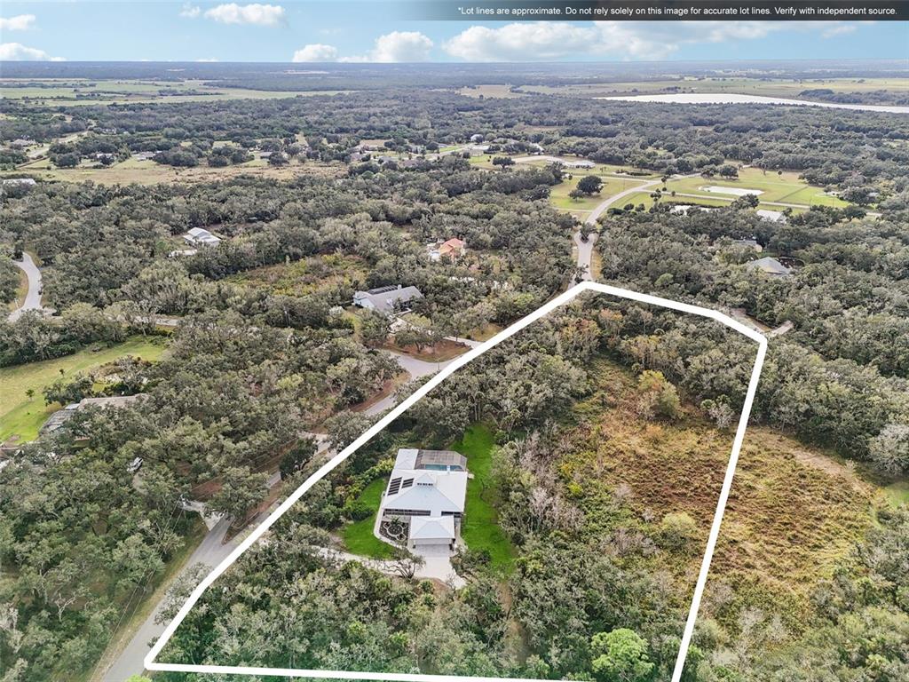 13221 North Branch Road Sarasota, FL 34240 - Photo 57 of 64 an aerial view of a residential houses with outdoor space and trees