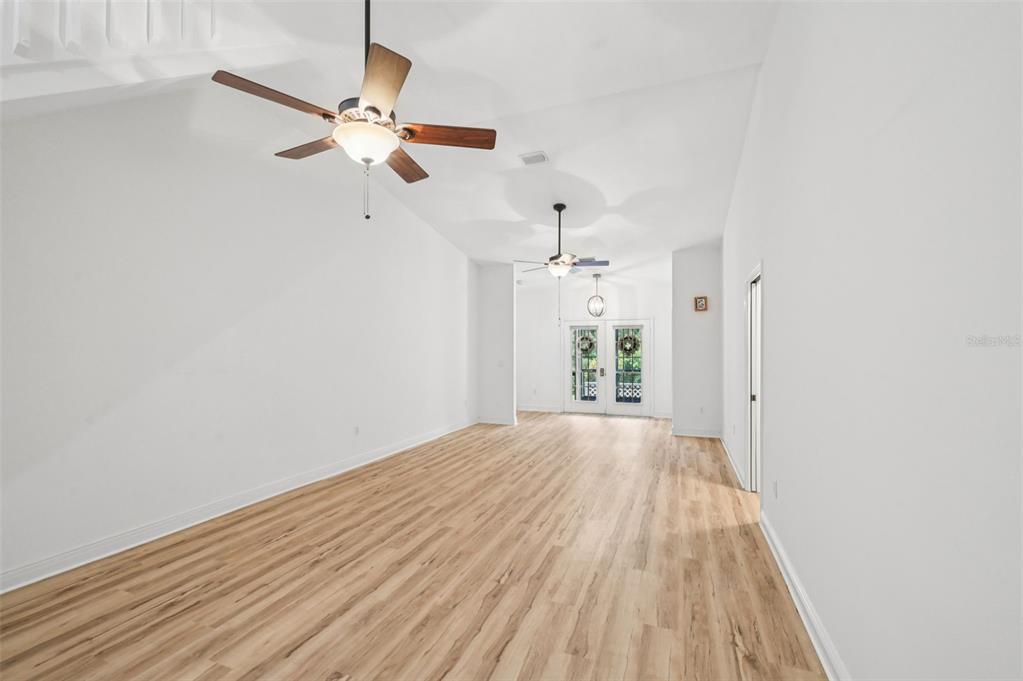 13221 North Branch Road Sarasota, FL 34240 - Photo 8 of 64 wooden floor in an empty room with a window
