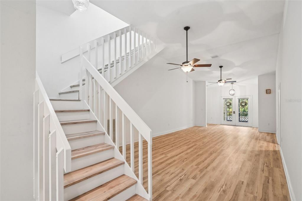 13221 North Branch Road Sarasota, FL 34240 - Photo 9 of 64 a view of a livingroom with wooden floor and stairs