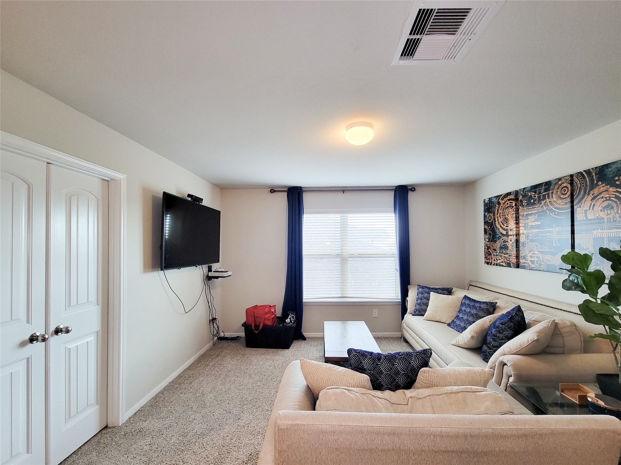 8003 Ecru Lane Rosharon, TX 77583 - Photo 19 of 35 a living room with furniture and a flat screen tv