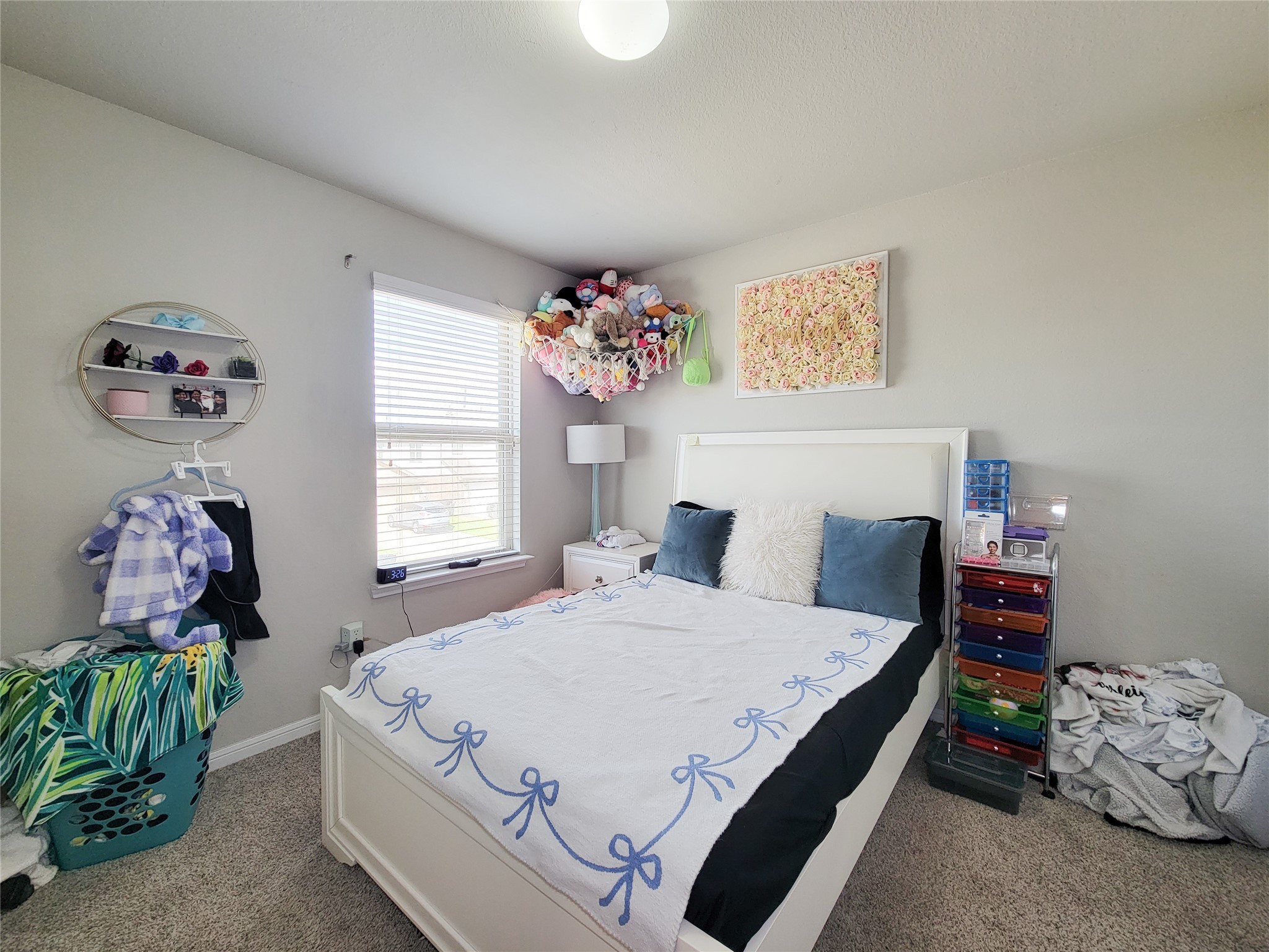 8003 Ecru Lane Rosharon, TX 77583 - Photo 23 of 36 a bedroom with a bed and a chandelier