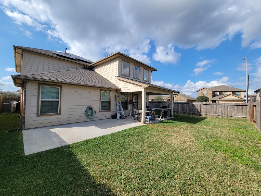 8003 Ecru Lane Rosharon, TX 77583 - Photo 27 of 35 The concrete patio space is large. Perfect for an outdoor grill!