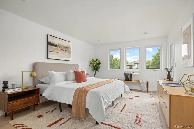 a bathroom with a double vanity sink mirror and shower
