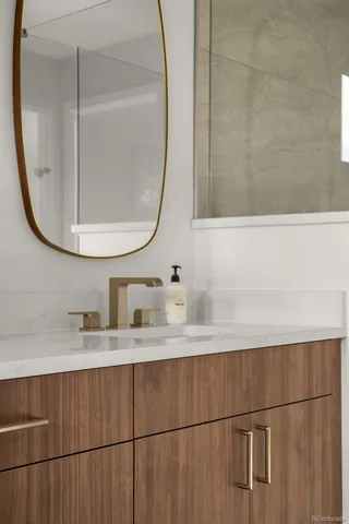 a bathroom with two sink and a mirror