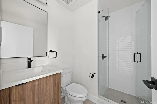 a view of a house with a yard and flower garden