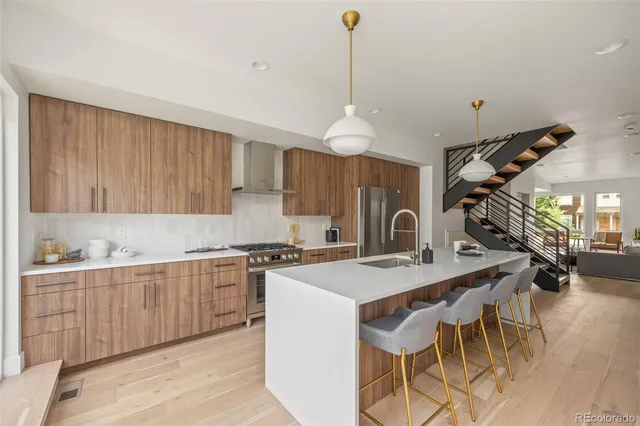 a kitchen with a sink and a refrigerator