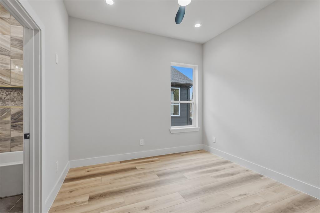 3914 Harlingen Street Dallas, TX 75212 - Photo 24 of 28 a view of empty room with wooden floor