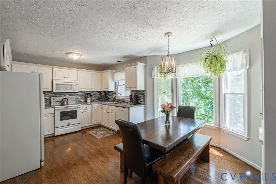 4501 Foxwood Road Chester, VA 23831 - Photo 8 of 42 Kitchen with white cabinetry, granite countertops,