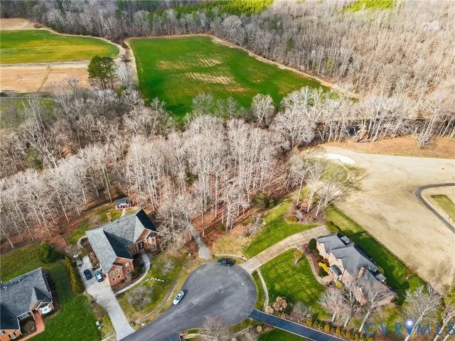 an aerial view of a house with yard swimming pool and outdoor seating