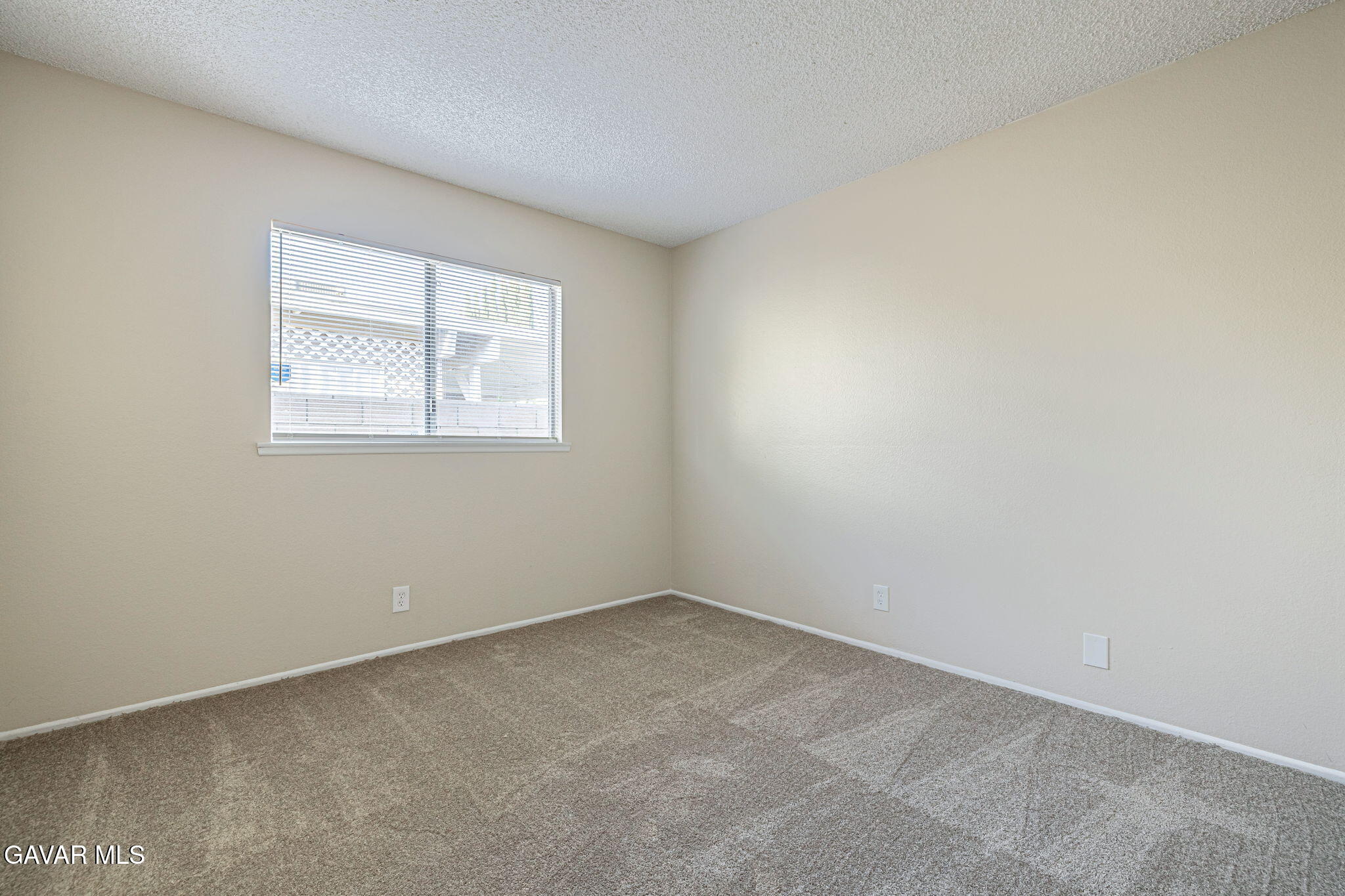 44422 Sancroft Avenue Lancaster, CA 93535 - Photo 22 of 35 an empty room with a window
