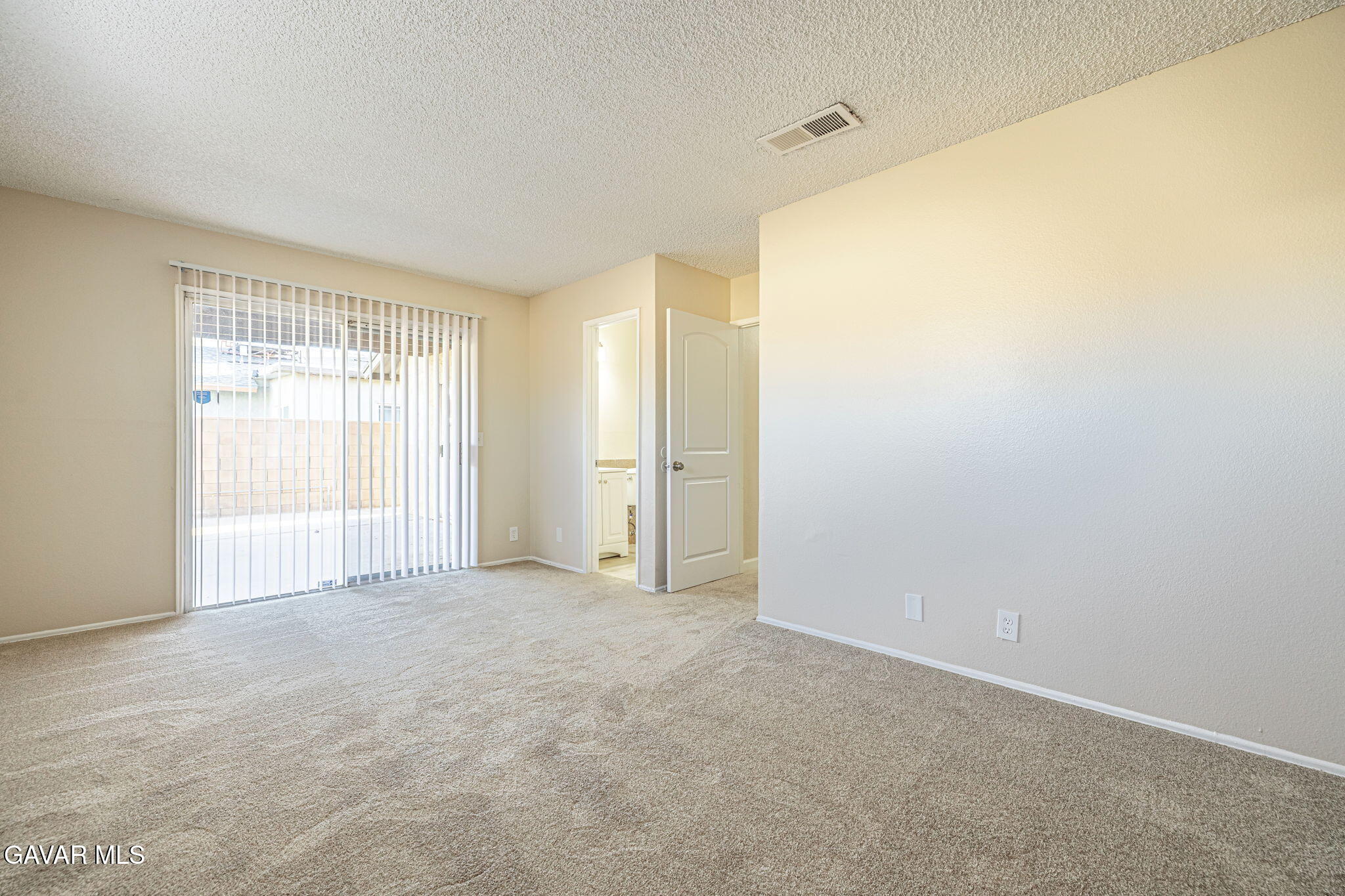 44422 Sancroft Avenue Lancaster, CA 93535 - Photo 25 of 35 a view of an empty room with a window