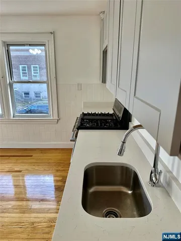 a bathroom with a sink and mirror