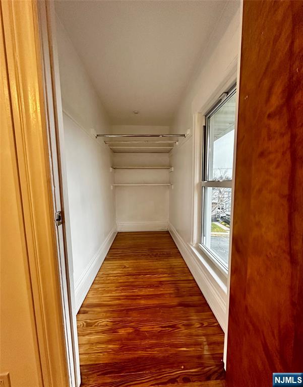227 Hamilton Avenue, Unit 2 Hasbrouck Heights, NJ 07604 - Photo 18 of 27 a view of a hallway with wooden floor and staircase