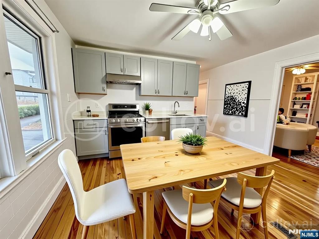 227 Hamilton Avenue, Unit 2 Hasbrouck Heights, NJ 07604 - Photo 8 of 27 a kitchen with a dining table and chairs