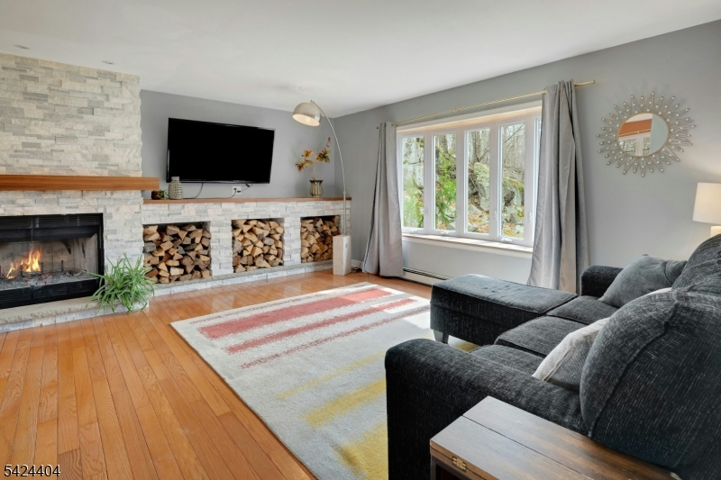 4 Andover Mohawk Road Sparta, NJ 07871 - Photo 18 of 35 a living room with furniture fireplace and flat screen tv