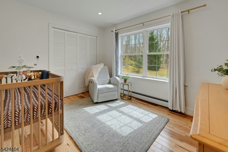 4 Andover Mohawk Road Sparta, NJ 07871 - Photo 20 of 35 a bedroom with furniture and a window