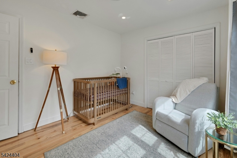 4 Andover Mohawk Road Sparta, NJ 07871 - Photo 21 of 35 a living room with a baby crib furniture and a window