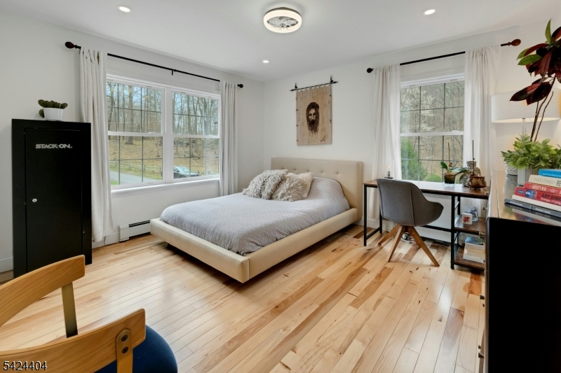 4 Andover Mohawk Road Sparta, NJ 07871 - Photo 24 of 35 a bedroom with a bed and wooden floor