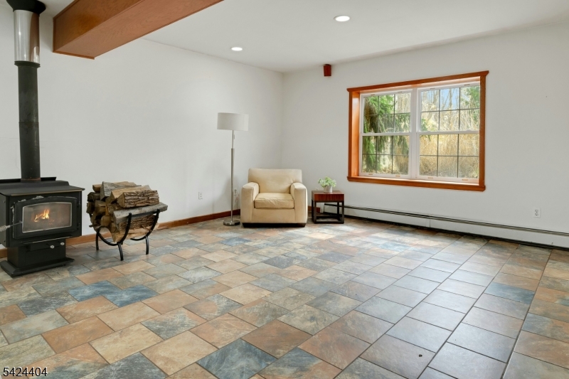 4 Andover Mohawk Road Sparta, NJ 07871 - Photo 26 of 35 a living room with furniture and a fireplace