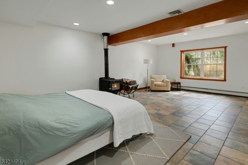 4 Andover Mohawk Road Sparta, NJ 07871 - Photo 27 of 35 a bedroom with a bed and a couch