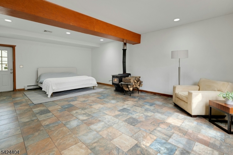 4 Andover Mohawk Road Sparta, NJ 07871 - Photo 29 of 35 a spacious bedroom with a bed and a couch