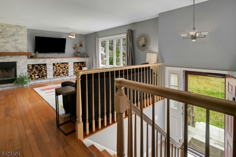 4 Andover Mohawk Road Sparta, NJ 07871 - Photo 6 of 35 a view of a livingroom with furniture fireplace flat screen tv and wooden floor