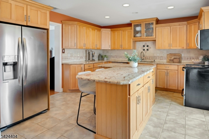 4 Andover Mohawk Road Sparta, NJ 07871 - Photo 8 of 35 a kitchen with stainless steel appliances granite countertop a refrigerator sink and cabinets