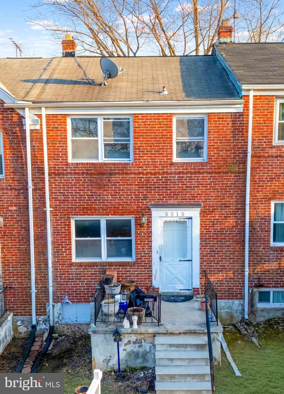 5515 Channing Road Baltimore, MD 21229 - Photo 1 of 10 a front view of a house with outdoor seating and barbeque oven