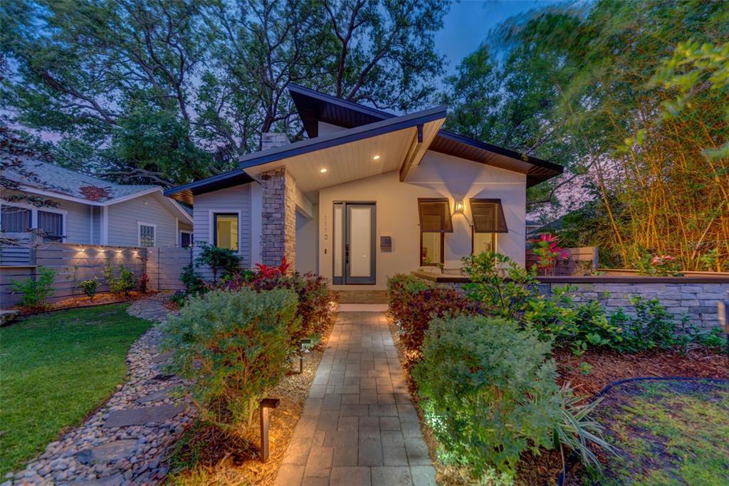 a front view of a house with garden