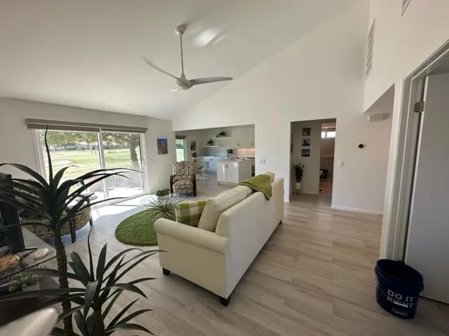 a living room with furniture and a window