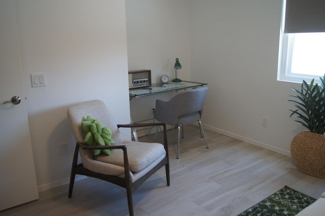 a kitchen with stainless steel appliances granite countertop a sink a stove and a refrigerator