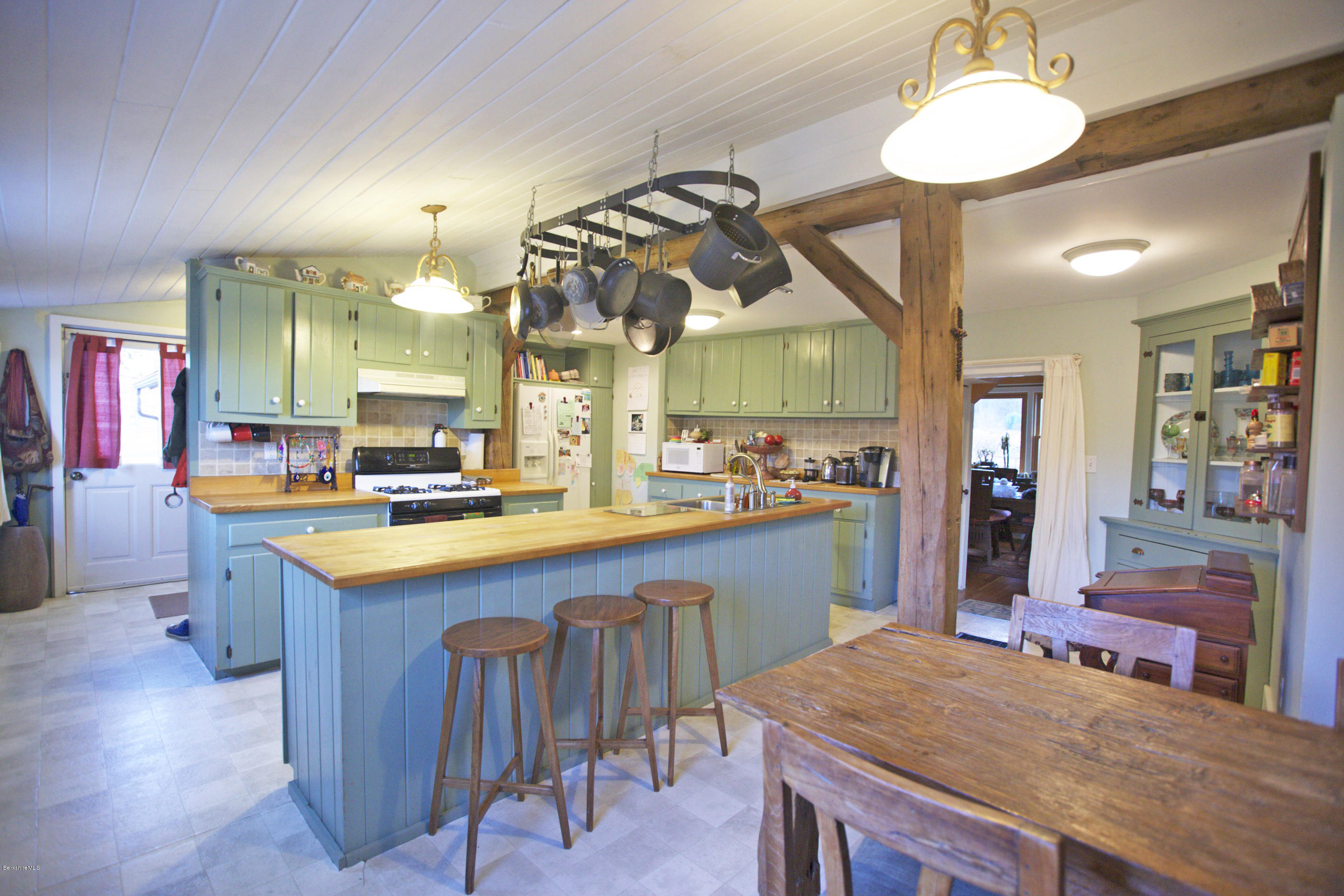 1286 Monterey Road Otis, MA 01253 - Photo 17 of 43 a kitchen with stainless steel appliances granite countertop wooden cabinets and sink