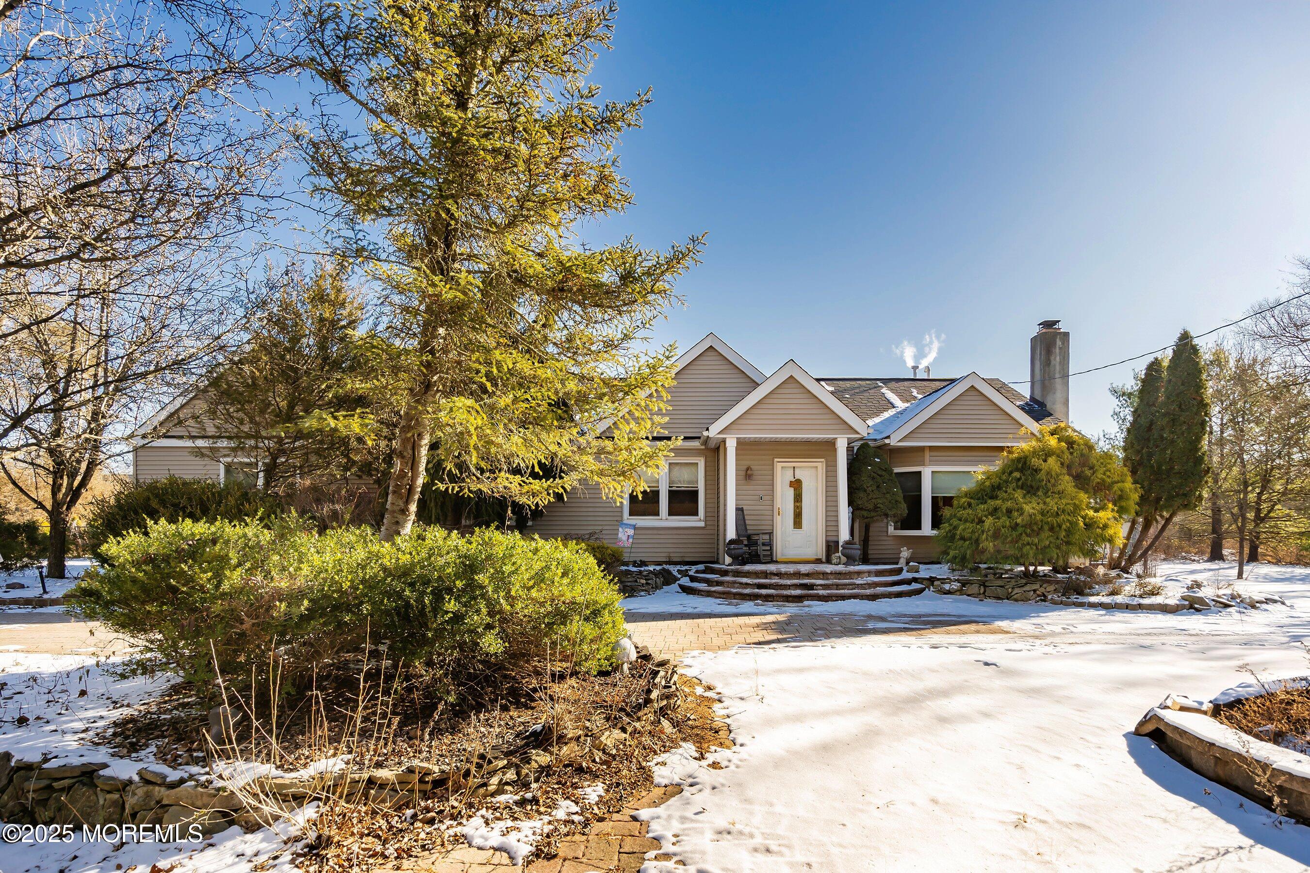 319 Jackson Mills Road Freehold, NJ 07728 - Photo 1 of 30 a front view of a house with a yard