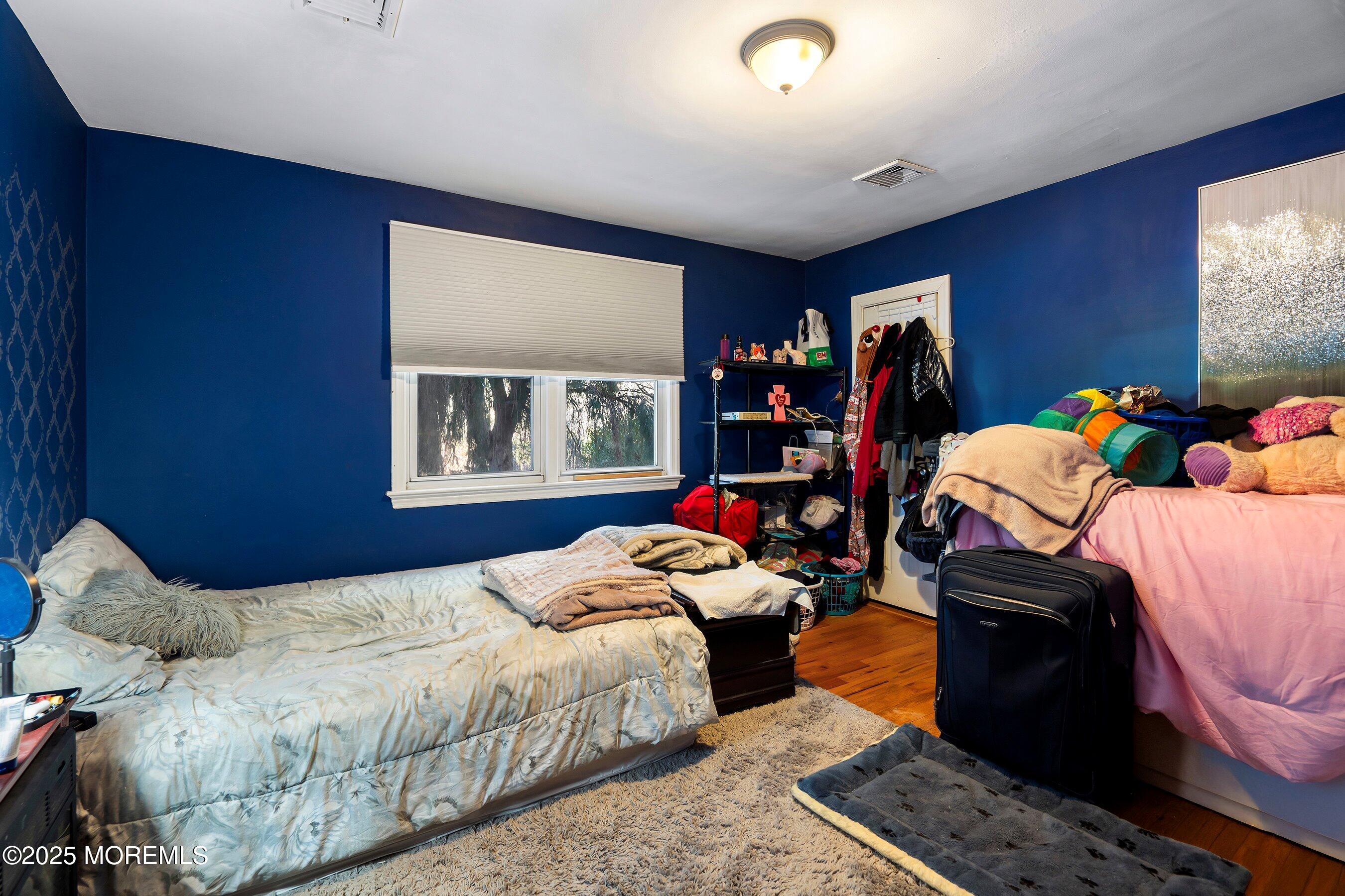 319 Jackson Mills Road Freehold, NJ 07728 - Photo 17 of 30 a bedroom with a bed and a window