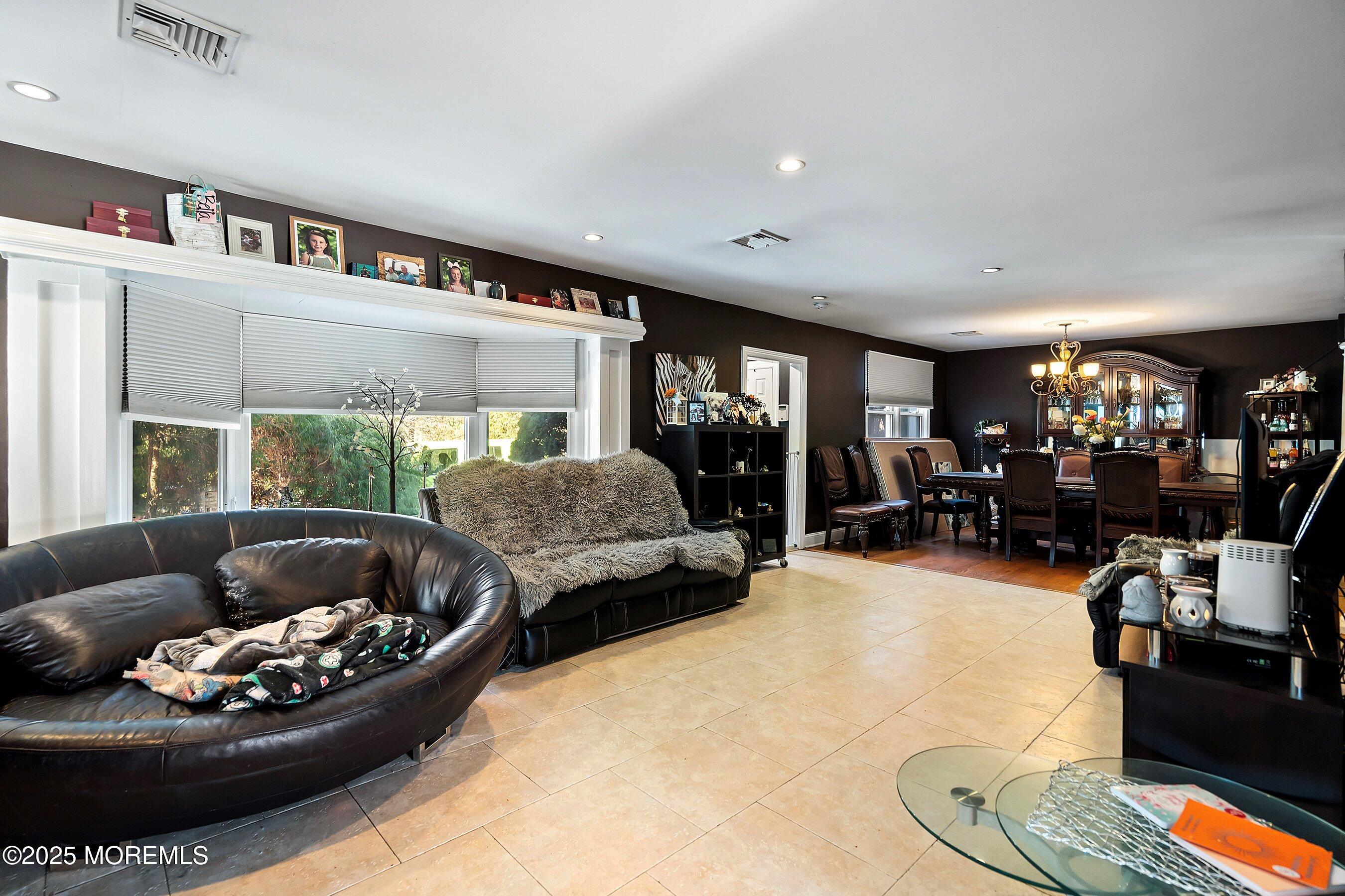 319 Jackson Mills Road Freehold, NJ 07728 - Photo 6 of 30 a living room with furniture and a large window