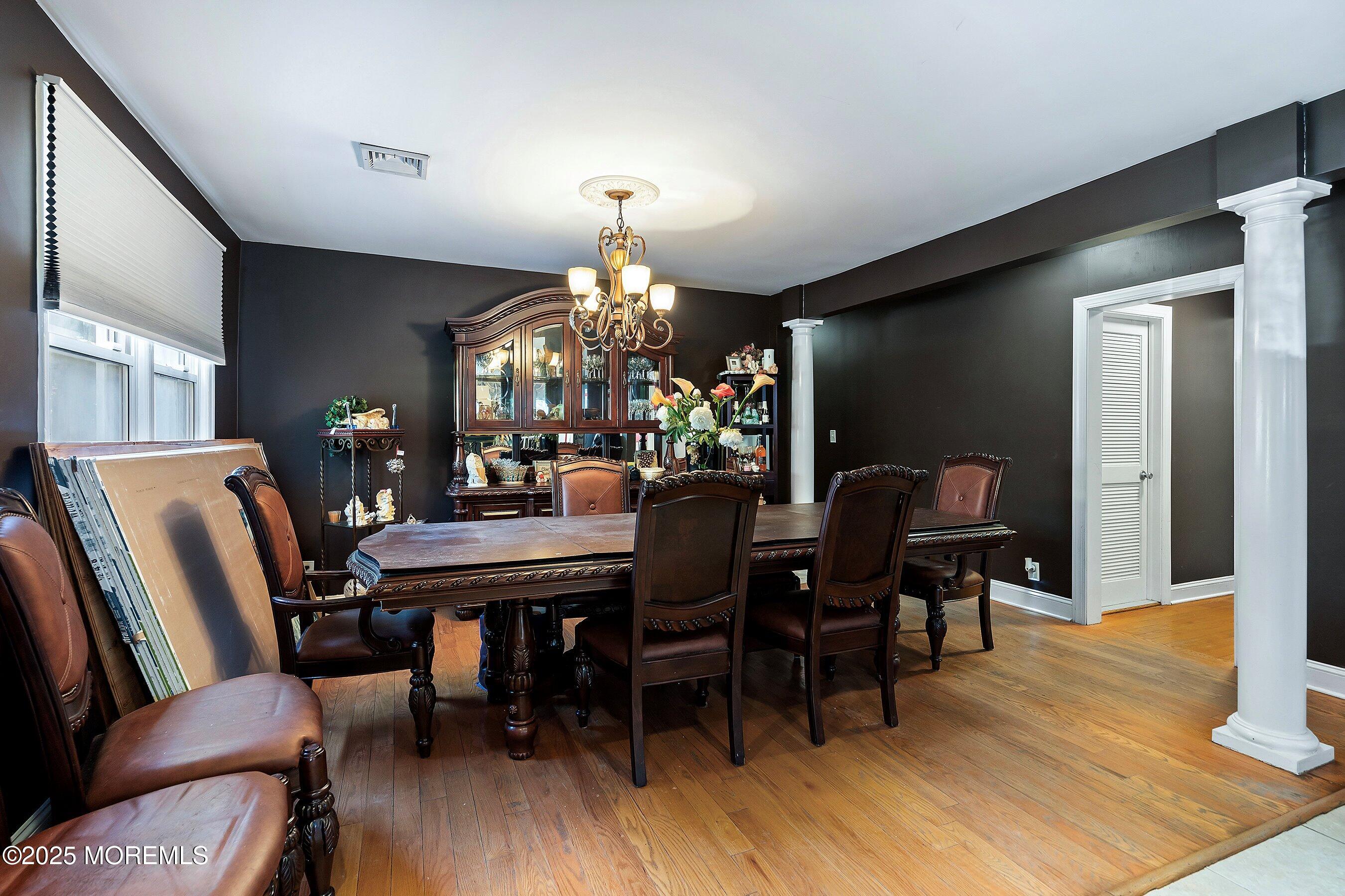 319 Jackson Mills Road Freehold, NJ 07728 - Photo 7 of 30 a view of a dining room with furniture and wooden floor