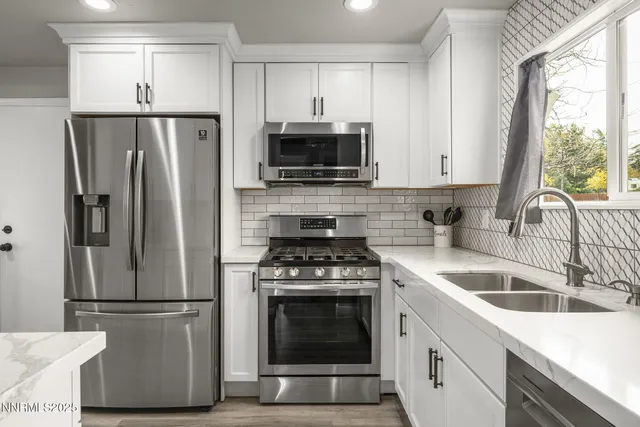 a kitchen with a stove microwave and refrigerator