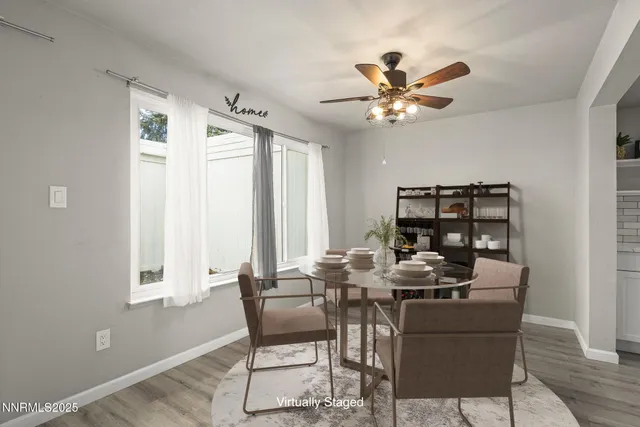 a dining room with furniture and window