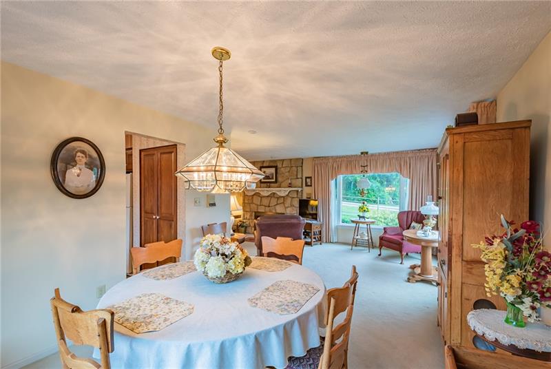 2016 Bushy Run Road Jeannette, PA 15644 - Photo 8 of 25 Attached dining room with open view to living room allows for the fireplace to be enjoyed even while at the table.