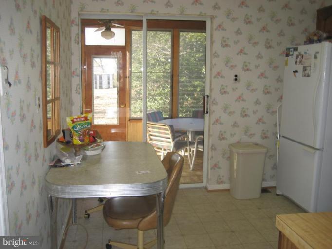 8710 Edmonston Road Berwyn Heights, MD 20740 - Photo 2 of 13 a view of a dining room with furniture and window