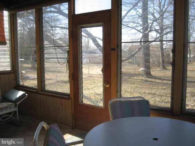 8710 Edmonston Road Berwyn Heights, MD 20740 - Photo 3 of 13 a view of a window in an empty room