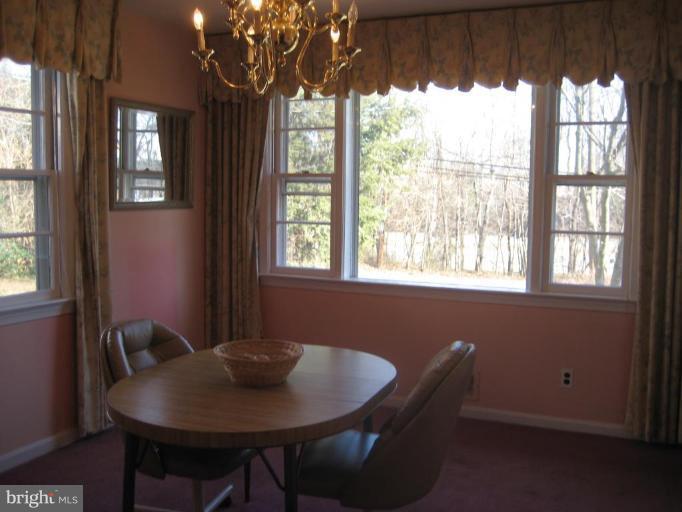 8710 Edmonston Road Berwyn Heights, MD 20740 - Photo 5 of 13 a view of a dining room with furniture window and outside view