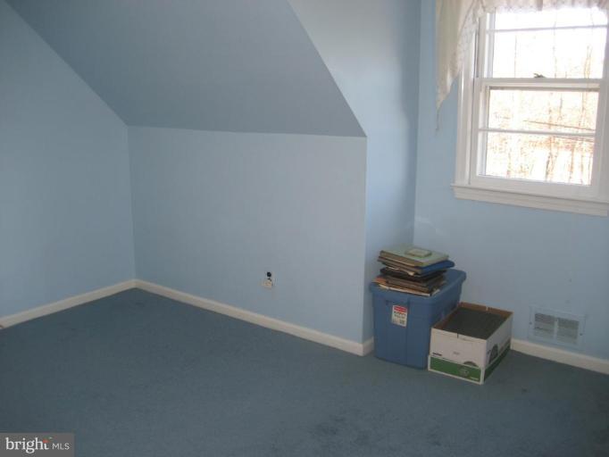 8710 Edmonston Road Berwyn Heights, MD 20740 - Photo 9 of 13 an empty room with a window