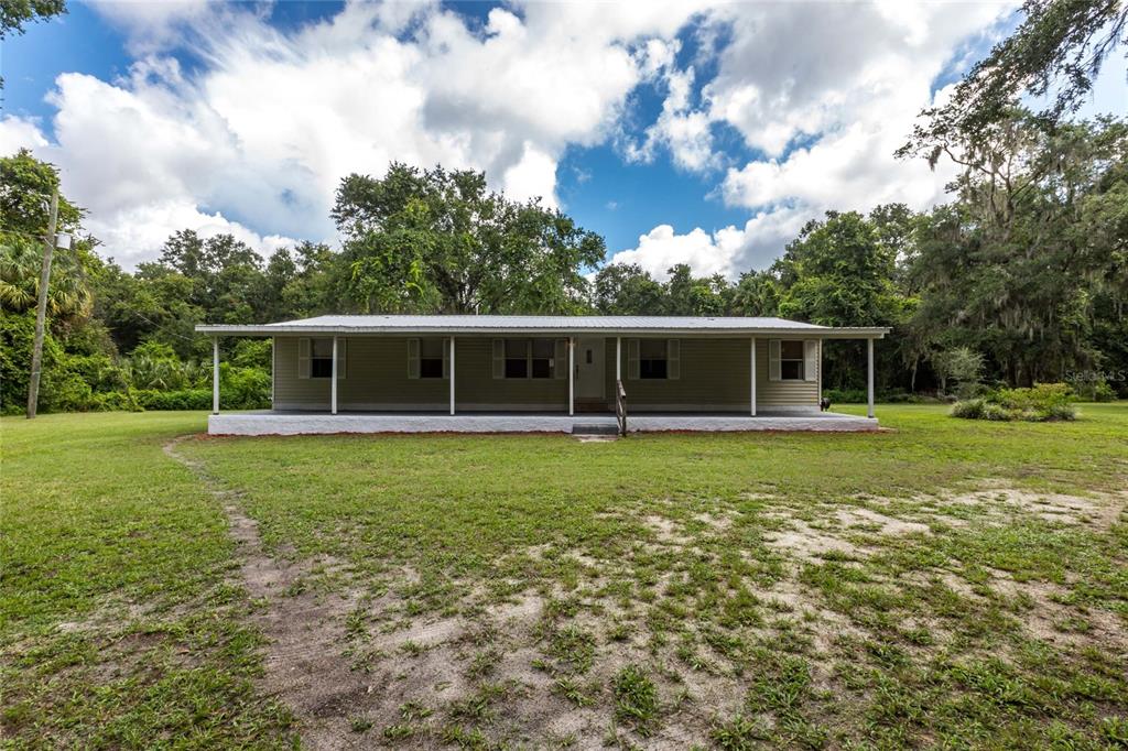 8521 Purvis Road Lithia, FL 33547 - Photo 1 of 1 a view of a house with a backyard