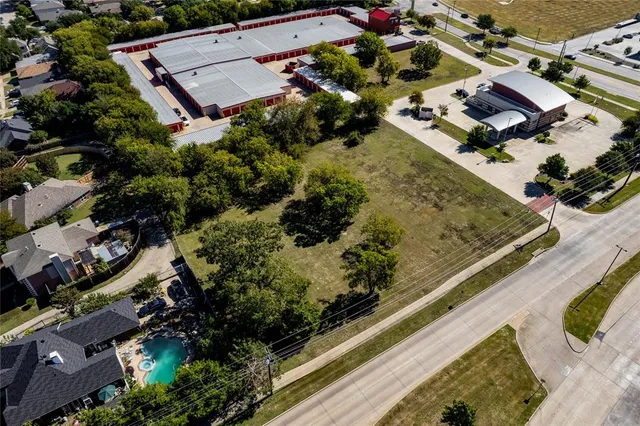 an aerial view of house with yard